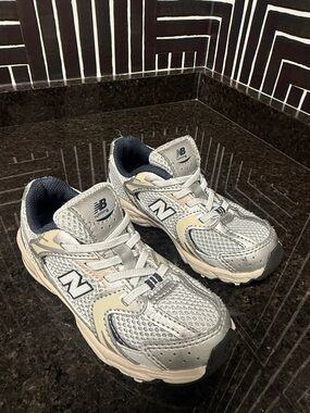 New Balance Kids Silver and Cream Athletic Sneakers